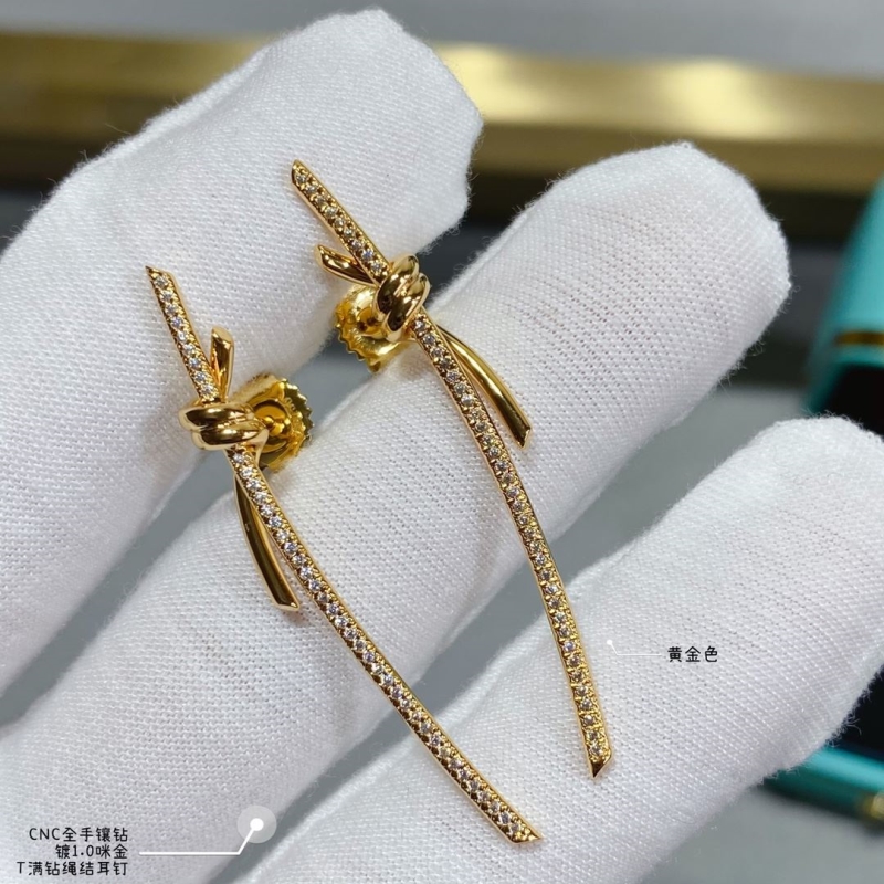 T*f*ny earrings